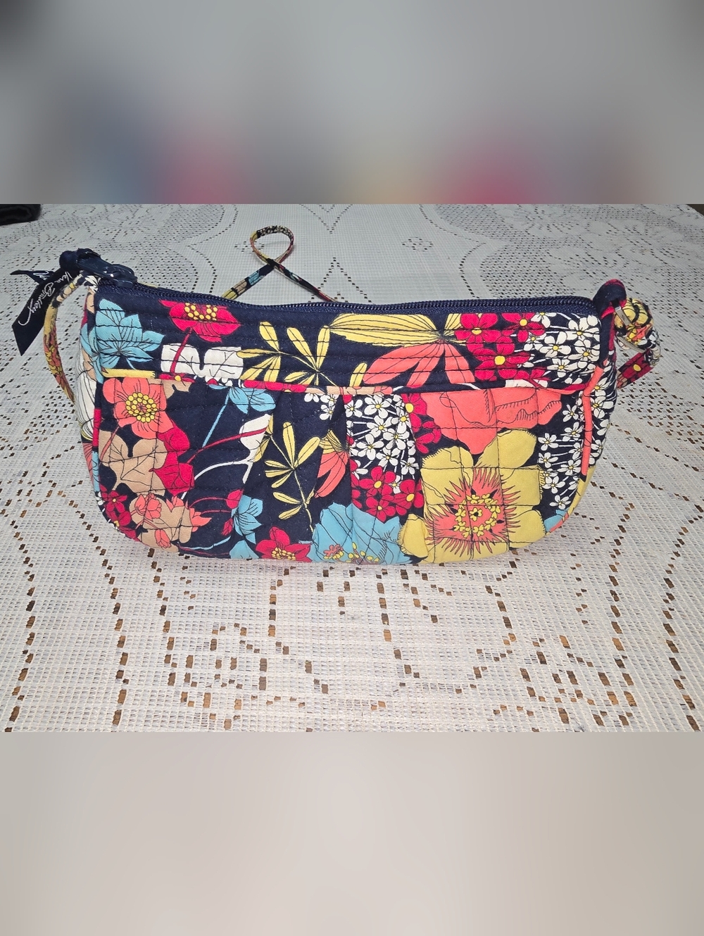 Vera Bradley Frannie crossbody bag in a floral pattern.